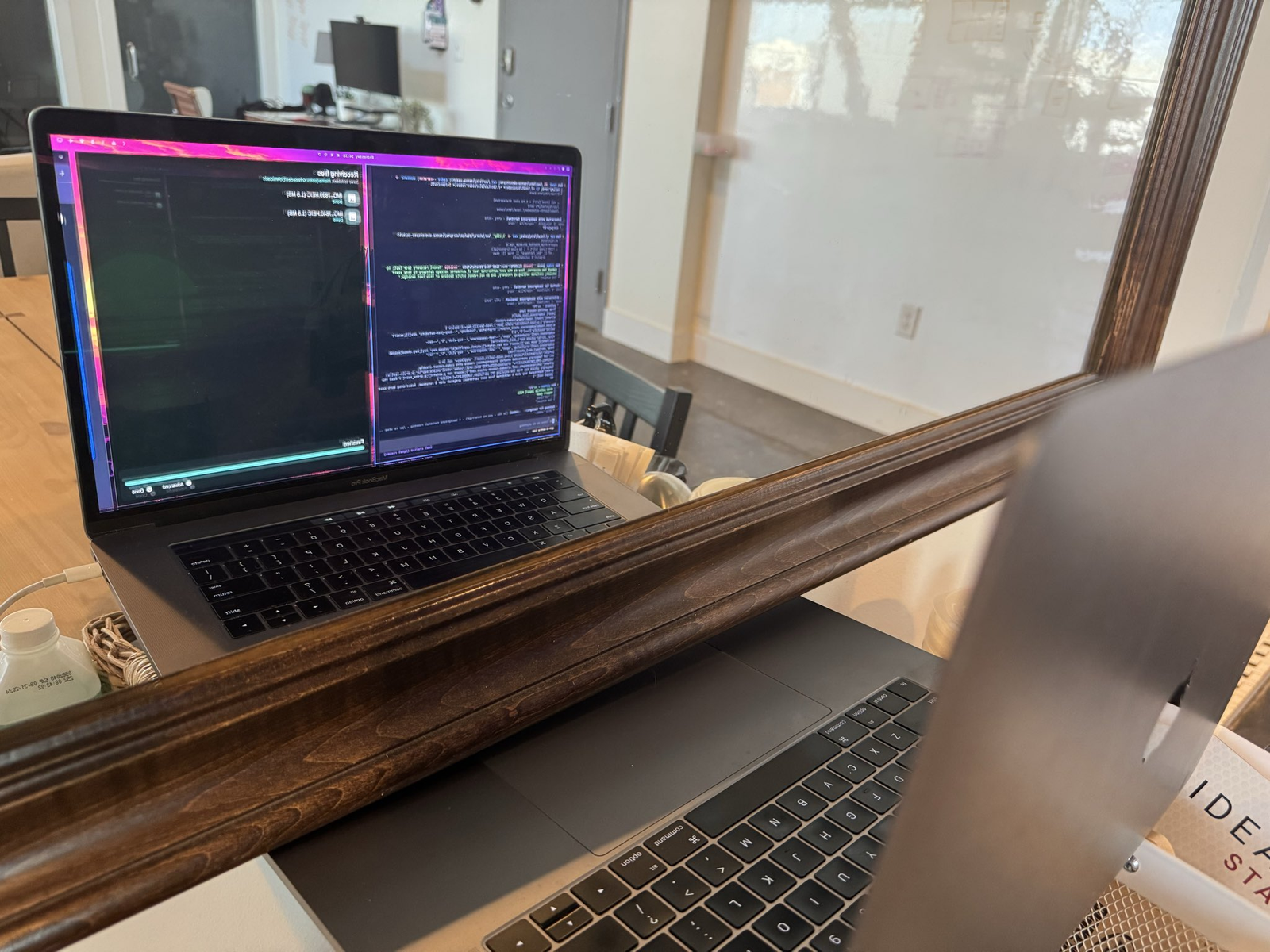 MacBook looking at itself in a mirror to self-improve